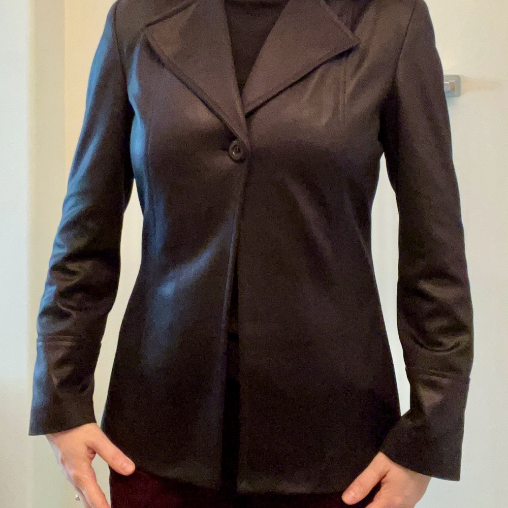 Black Jacket with a long tailored skirt.